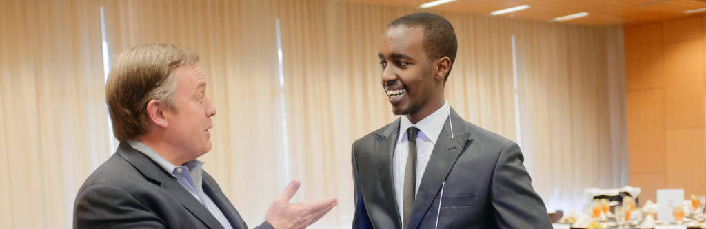 President Crow talking with scholar